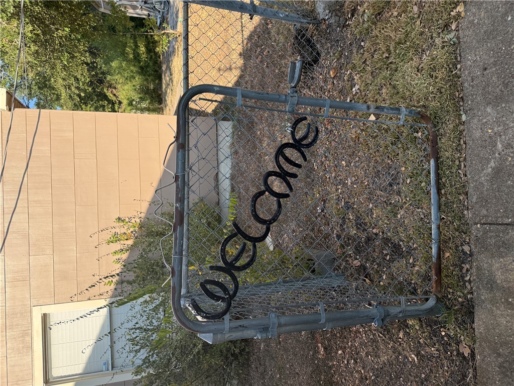 709 Churchill Drive Bryan, TX 77801 - Photo 19 of 31 a view of a wooden fence next to a road