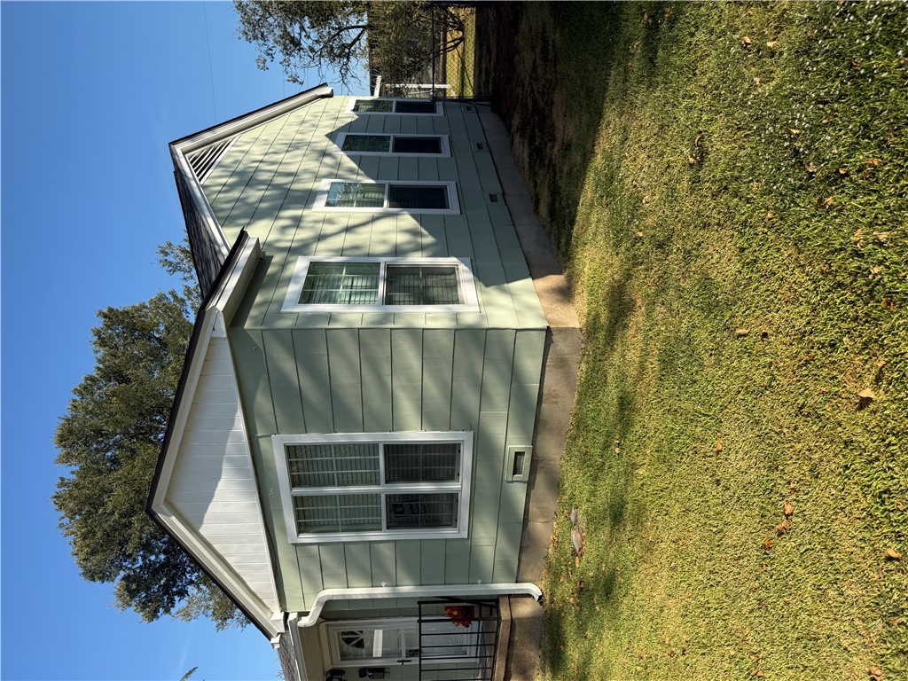 709 Churchill Drive Bryan, TX 77801 - Photo 29 of 31 a view of a house with a yard