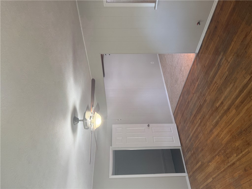 709 Churchill Drive Bryan, TX 77801 - Photo 3 of 31 a view of empty room with wooden floor