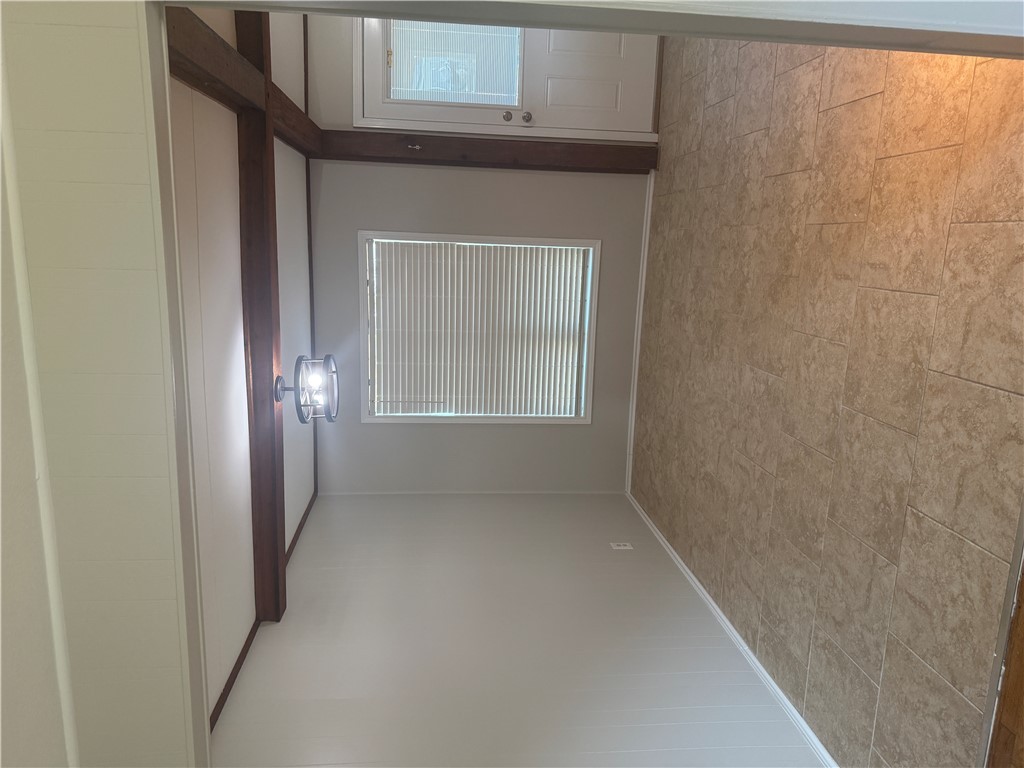 709 Churchill Drive Bryan, TX 77801 - Photo 5 of 31 a view of an empty room with a window