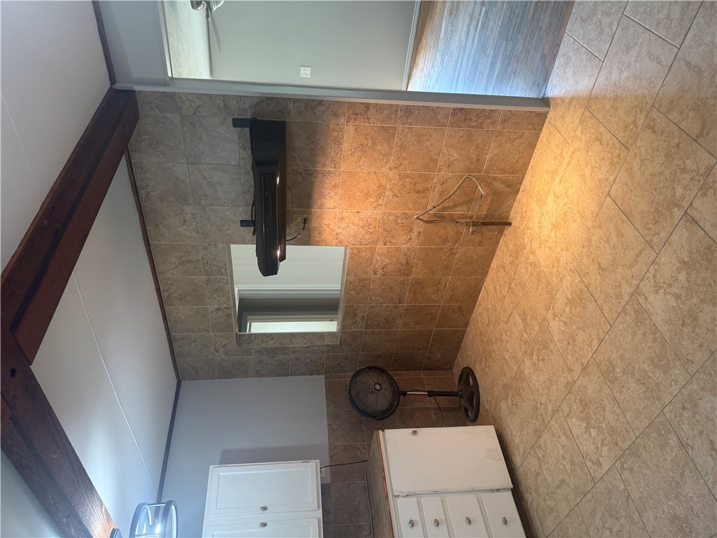 709 Churchill Drive Bryan, TX 77801 - Photo 7 of 31 a bathroom with a granite countertop sink a toilet and mirror
