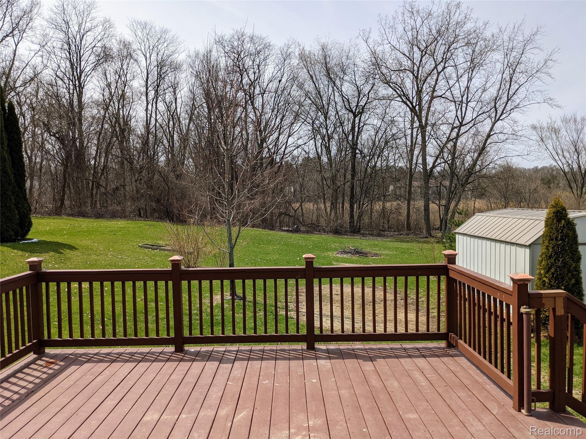 67 North Roslyn Road Waterford, MI 48328 - Photo 18 of 23 Deck off the doorwall to the Master Suite