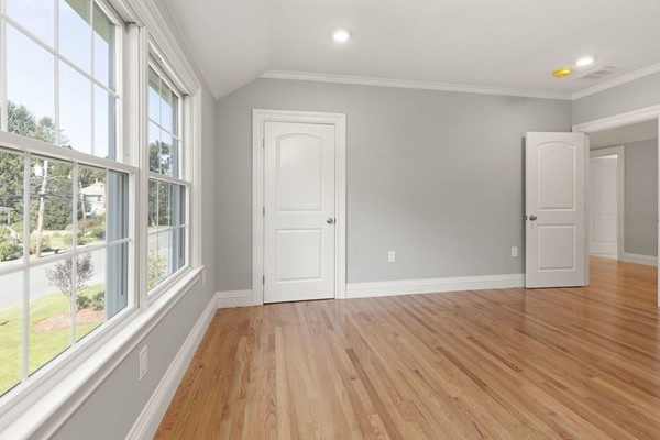 43 Reed Street Lexington, MA 02421 - Photo 15 of 28 a view of an empty room with wooden floor and a window