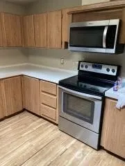 a kitchen with a stove and a microwave