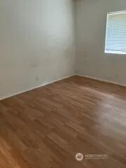 an empty room with wooden floor