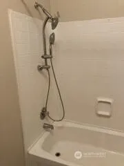 a bathroom with a bath tub