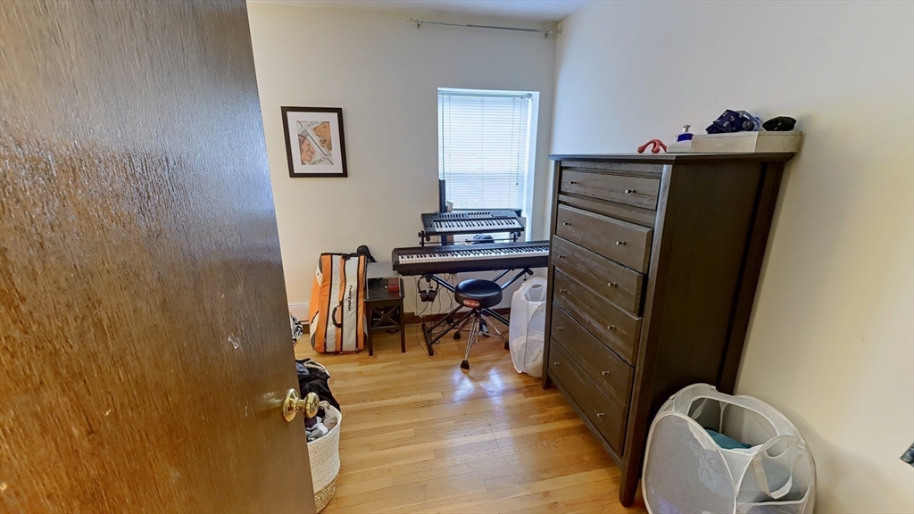 267 Main, Unit 3A Boston, MA 02129 - Photo 5 of 9 a view of a workspace with furniture and a gate