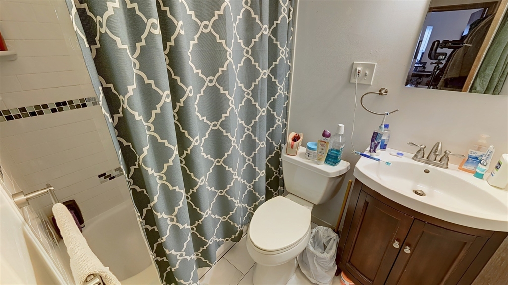 267 Main, Unit 3A Boston, MA 02129 - Photo 6 of 9 a bathroom with a sink toilet and shower