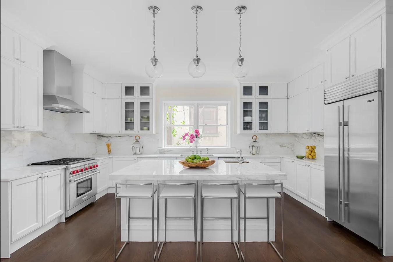 236 West 24th Street, Unit PH Manhattan, NY 10011 - Photo 1 of 14 a kitchen with a sink stove and refrigerator