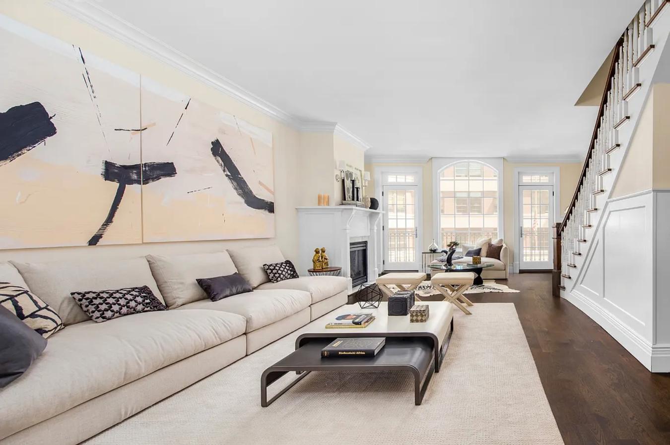 236 West 24th Street, Unit PH Manhattan, NY 10011 - Photo 3 of 14 a living room with furniture and a large window