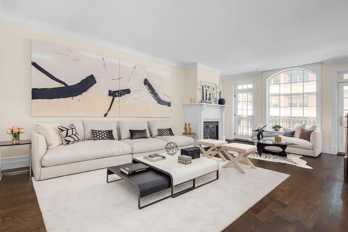 236 West 24th Street, Unit PH Manhattan, NY 10011 - Photo 4 of 14 a living room with furniture white walls and a fireplace