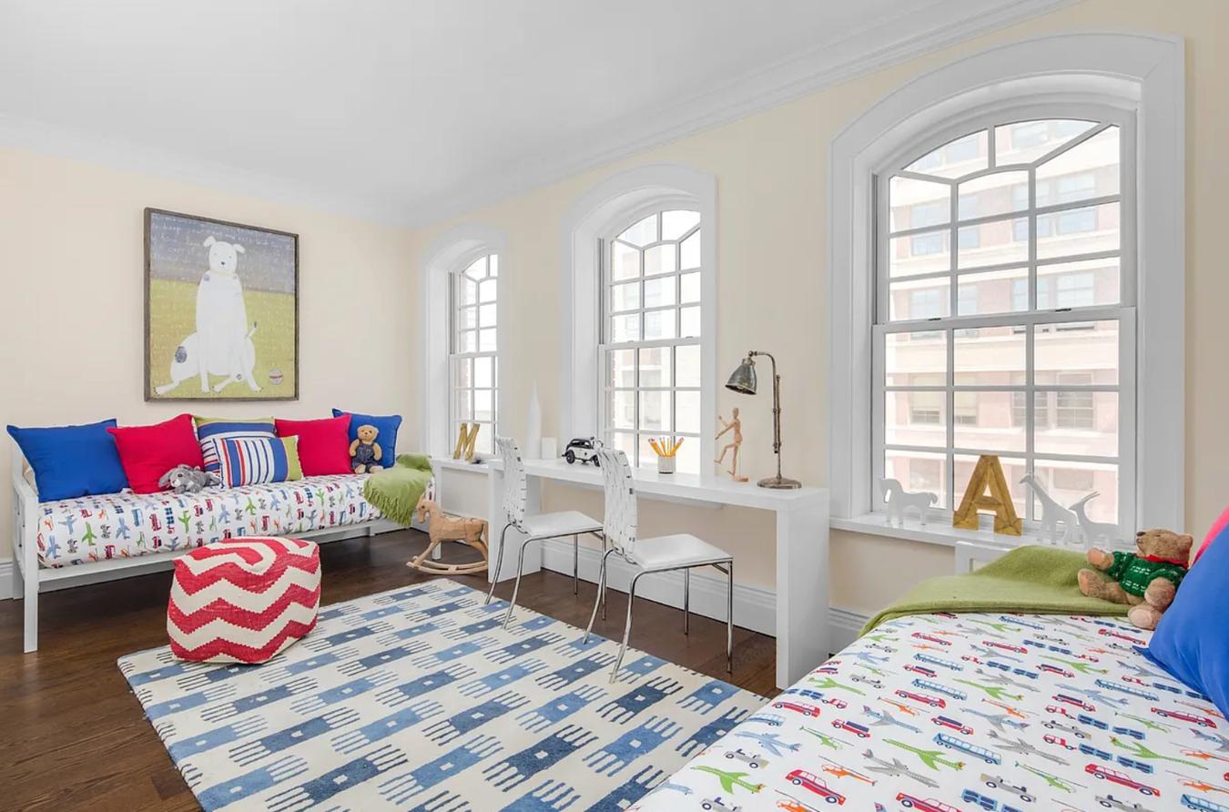 236 West 24th Street, Unit PH Manhattan, NY 10011 - Photo 10 of 14 a living room with furniture and a large window