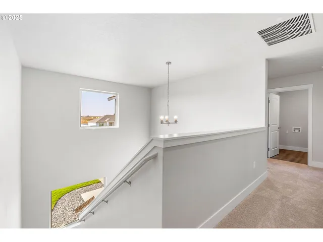 a view of hallway with stairs