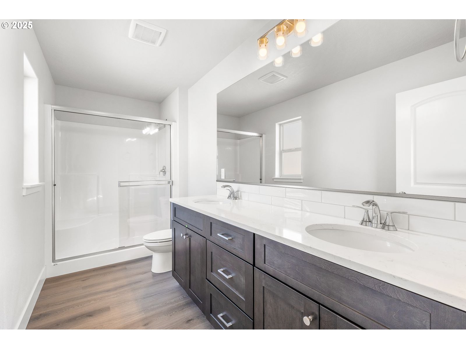 104 Tiber Court Boardman, OR 97818 - Photo 16 of 33 a bathroom with a granite countertop sink mirror and double