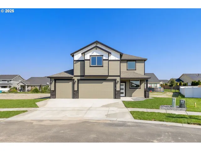 a front view of a house with a yard
