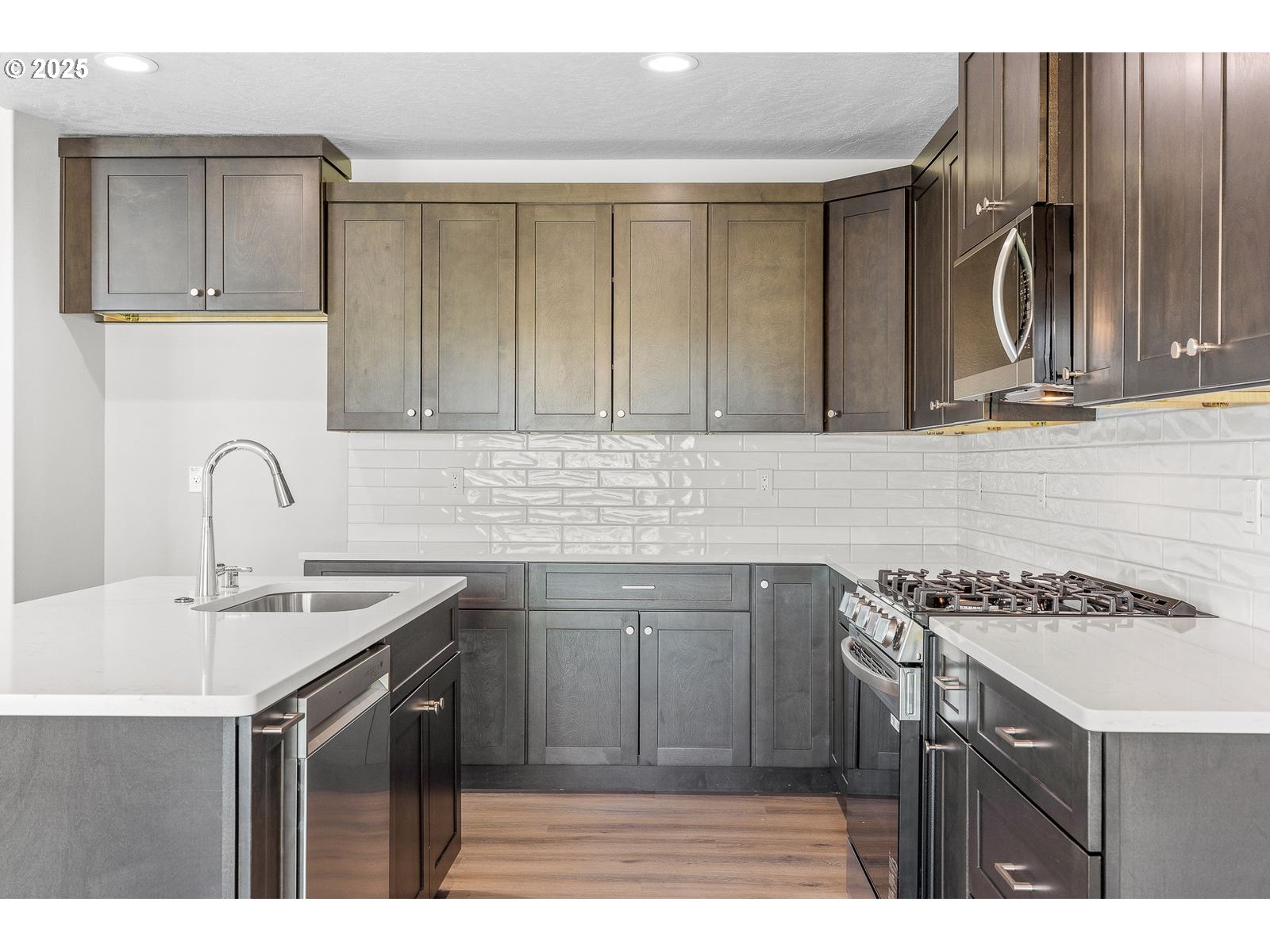 104 Tiber Court Boardman, OR 97818 - Photo 22 of 33 a kitchen with a sink cabinets and appliances