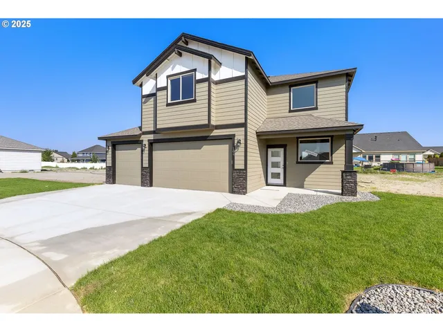 a front view of a house with a yard