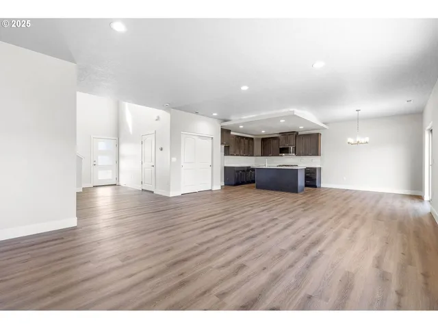 a view of kitchen and wooden floor