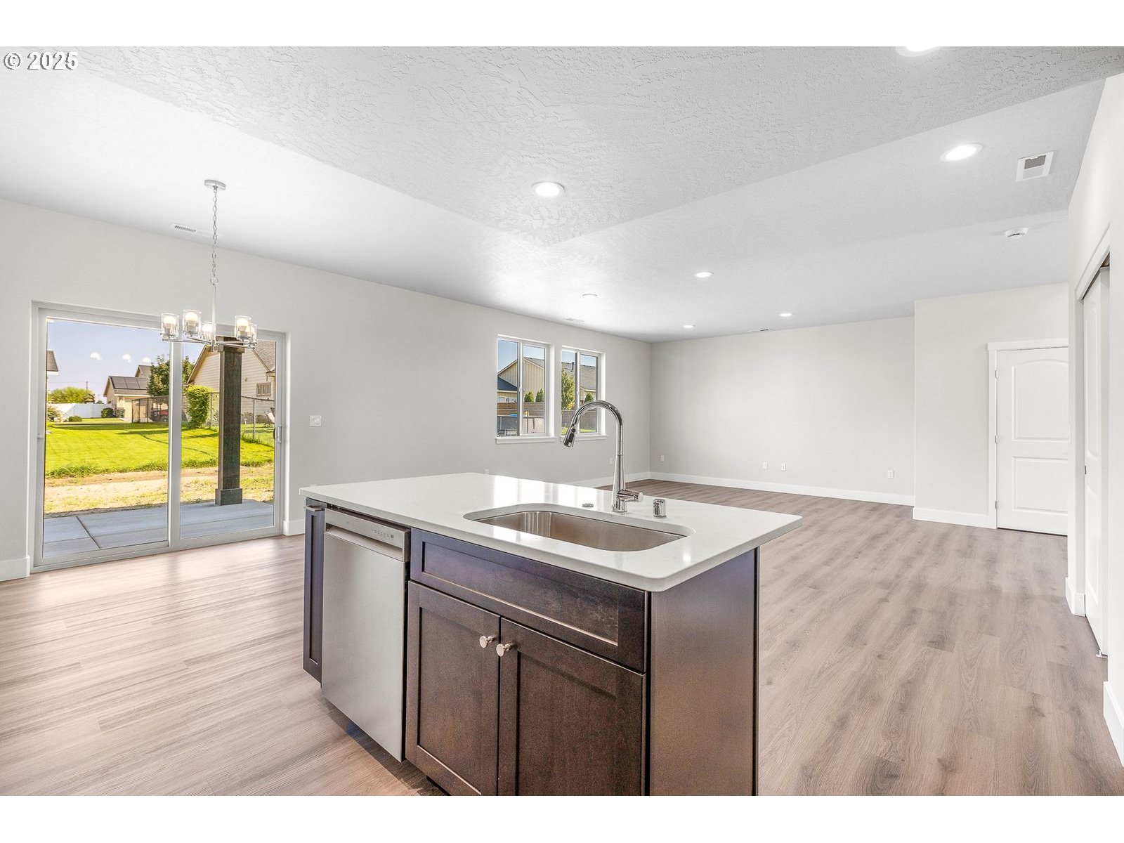 104 Tiber Court Boardman, OR 97818 - Photo 10 of 33 a kitchen with a sink a counter space and appliances