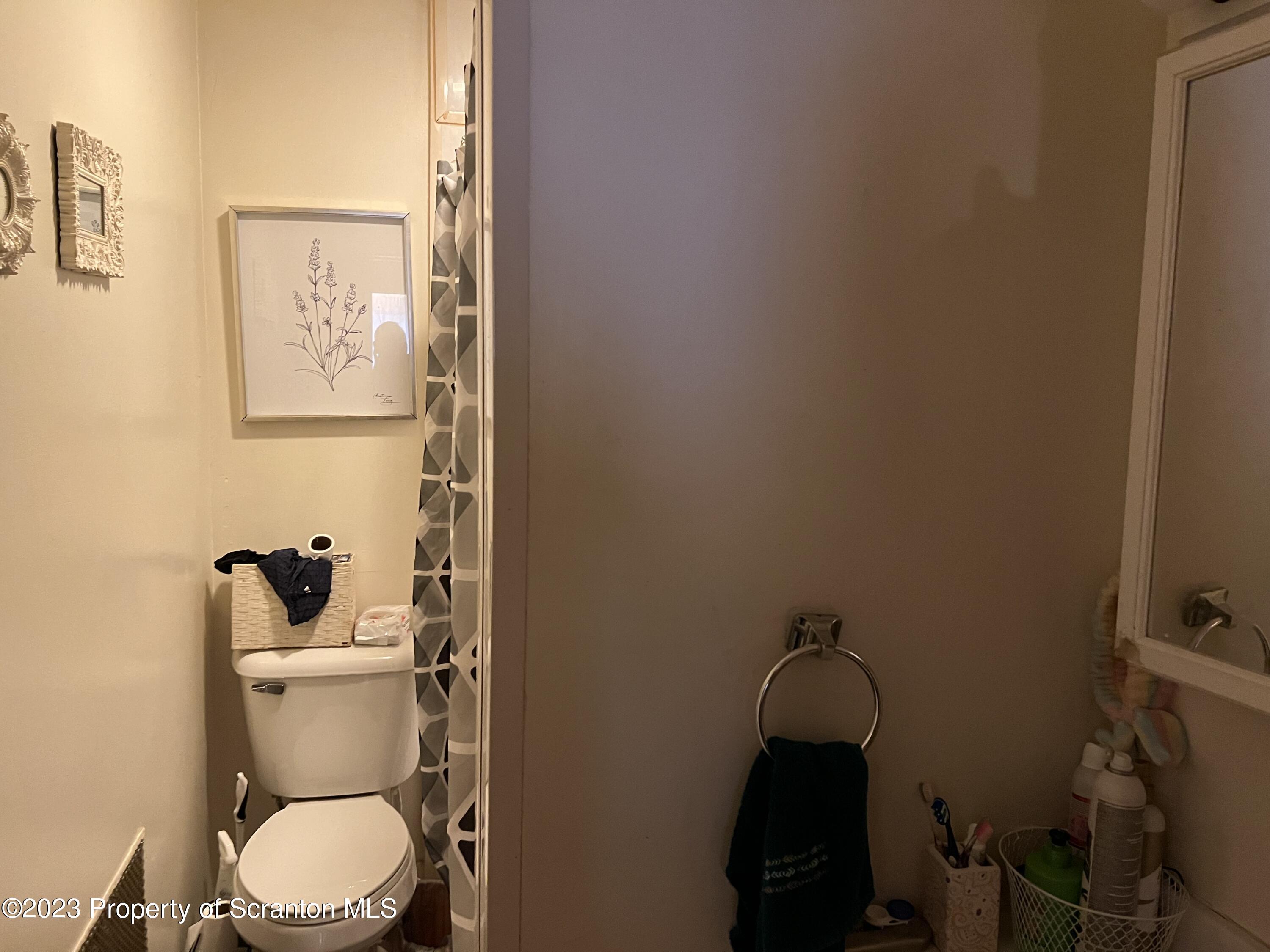 1613 Olive Street Scranton, PA 18510 - Photo 12 of 22 a bathroom with a toilet and a sink