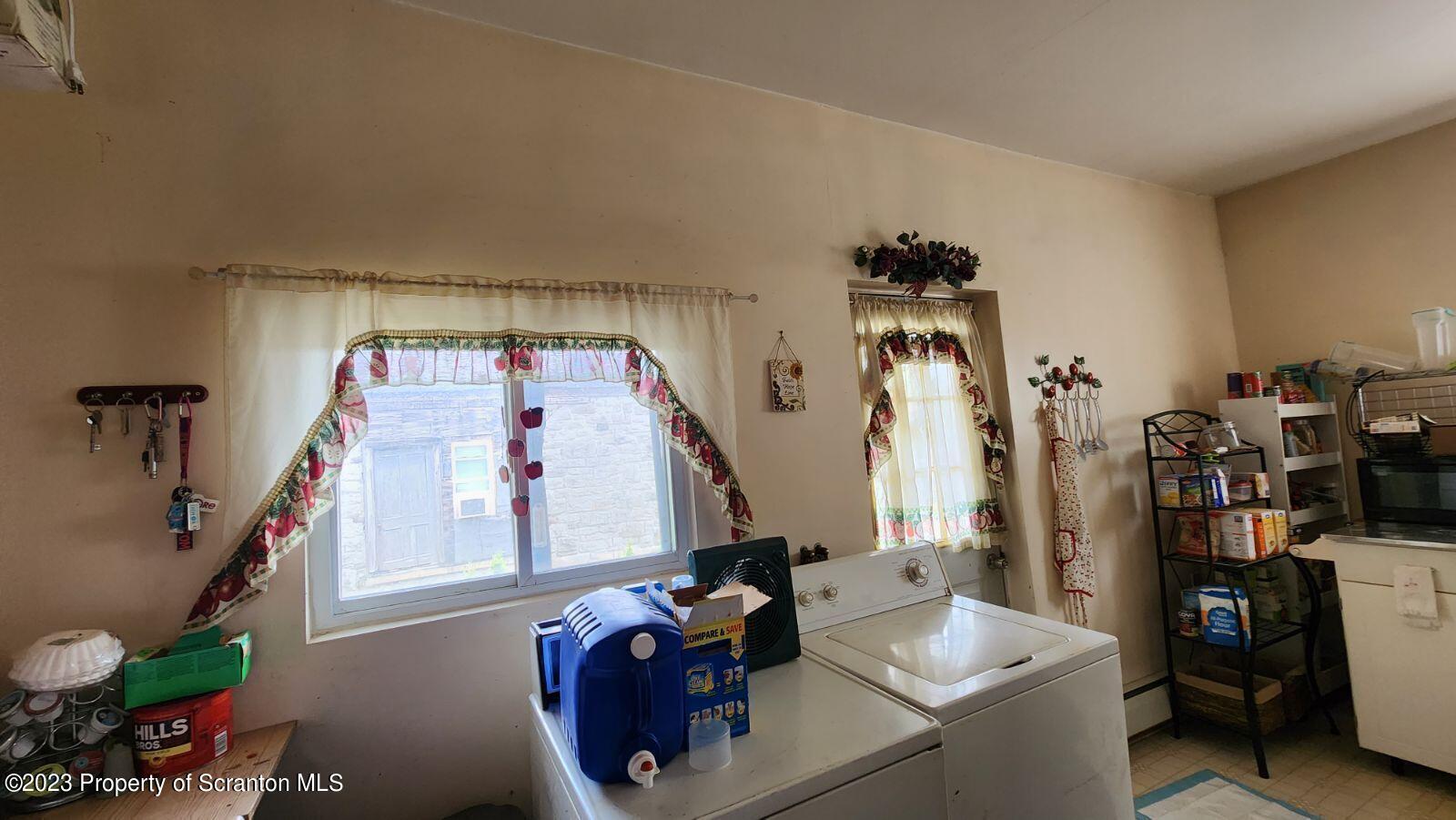 1613 Olive Street Scranton, PA 18510 - Photo 18 of 22 a room with gym equipment and a large window
