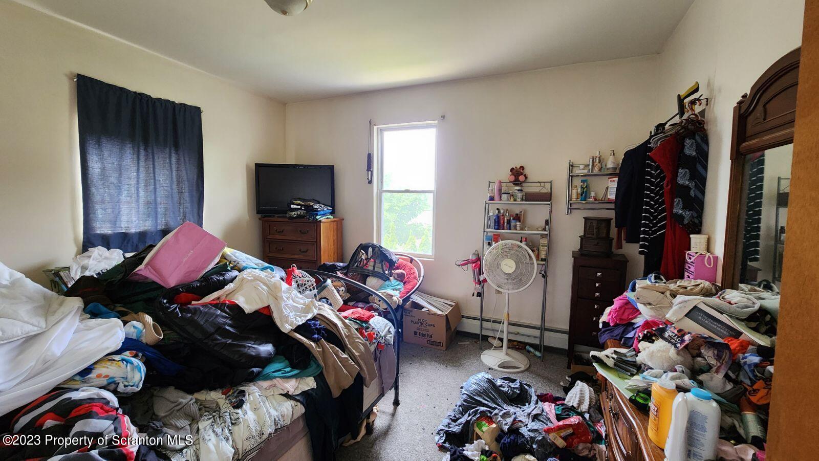 1613 Olive Street Scranton, PA 18510 - Photo 20 of 22 a bedroom with furniture and a closet