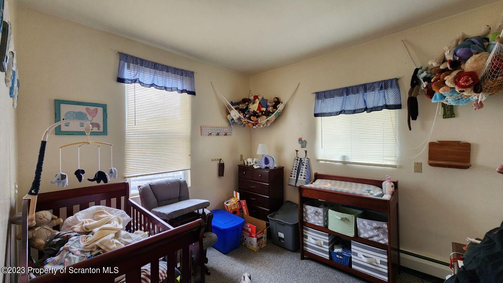 1613 Olive Street Scranton, PA 18510 - Photo 22 of 22 a bedroom with furniture and a window