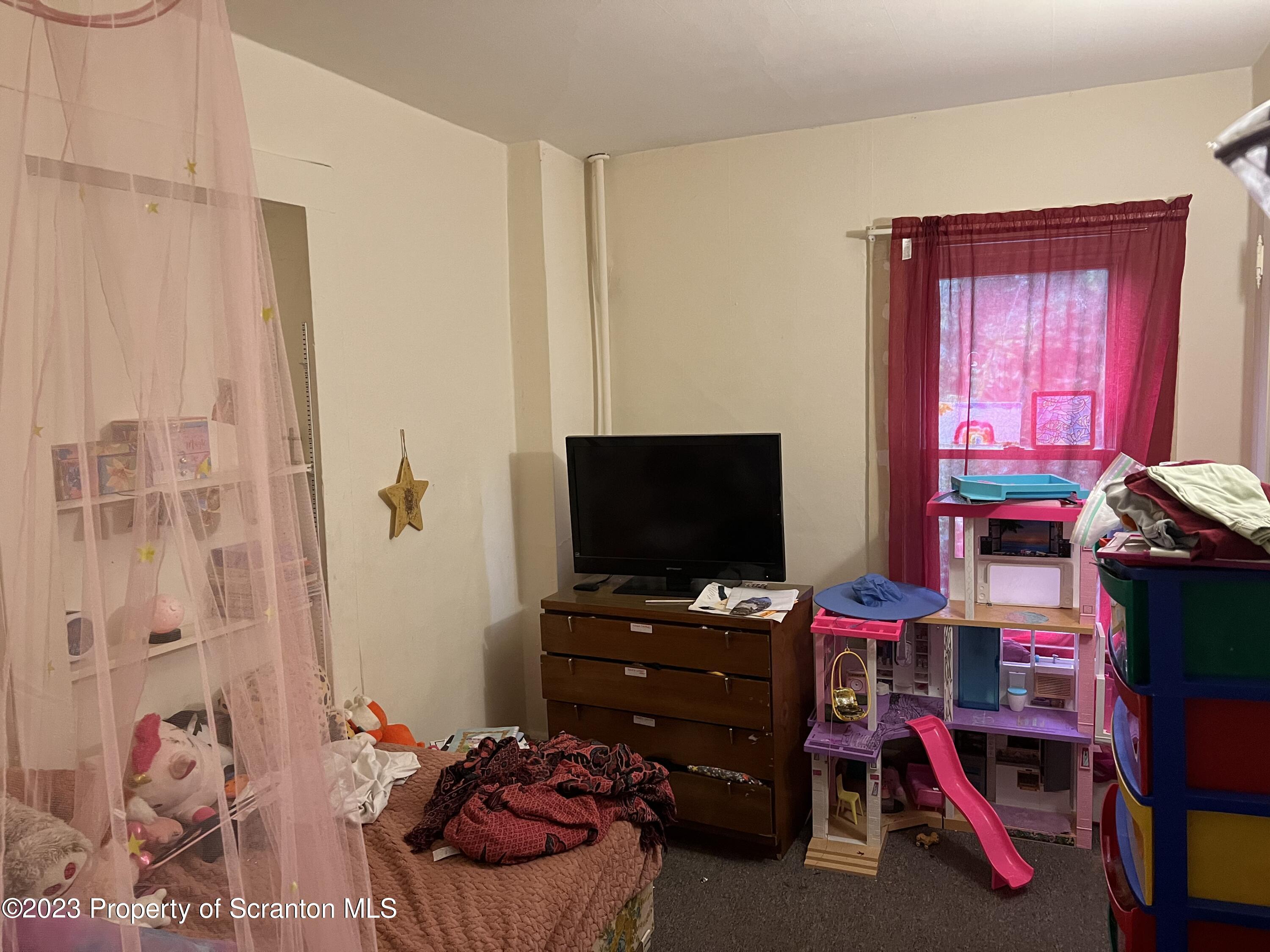 1613 Olive Street Scranton, PA 18510 - Photo 10 of 22 a room with furniture and a flat screen tv