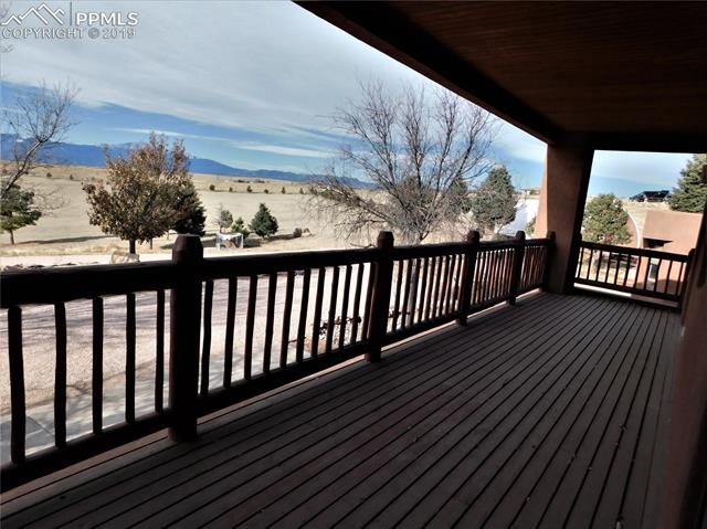 4320 Meridian Road Peyton, CO 80831 - Photo 4 of 28 Covered patio off living room and master bedroom