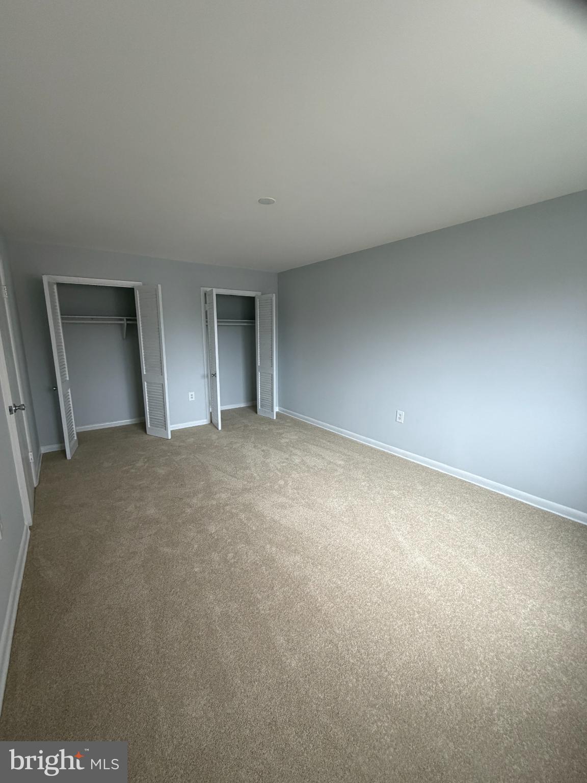 11514 Bucknell Drive, Unit 102 Silver Spring, MD 20902 - Photo 13 of 23 Primary bedroom with soft tones.