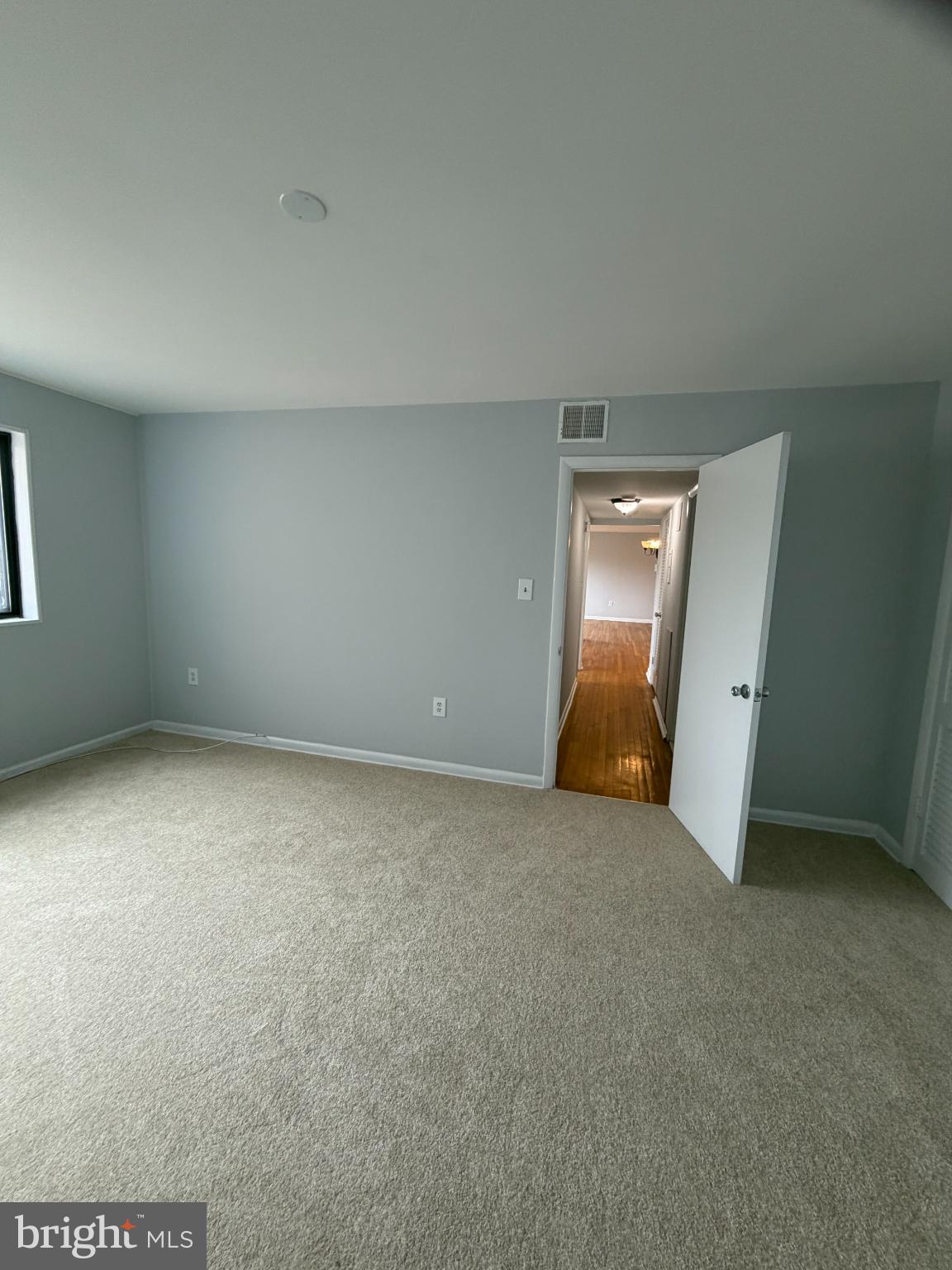 11514 Bucknell Drive, Unit 102 Silver Spring, MD 20902 - Photo 15 of 23 Primary bedroom view to hallway.