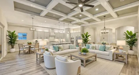 a living room with furniture a fireplace and a potted plant