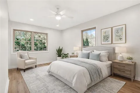 a bedroom with a large bed and a couch