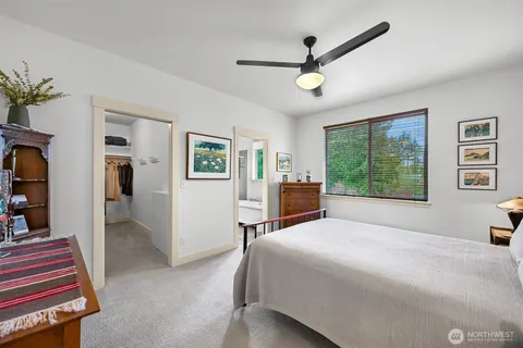 a bed room with a bed and a window