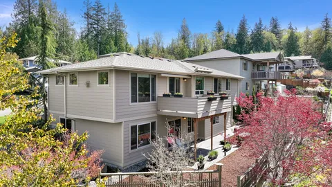 a aerial view of a house with a garden and trees