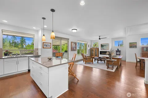 a view of living room with granite countertop kitchen island furniture and a table