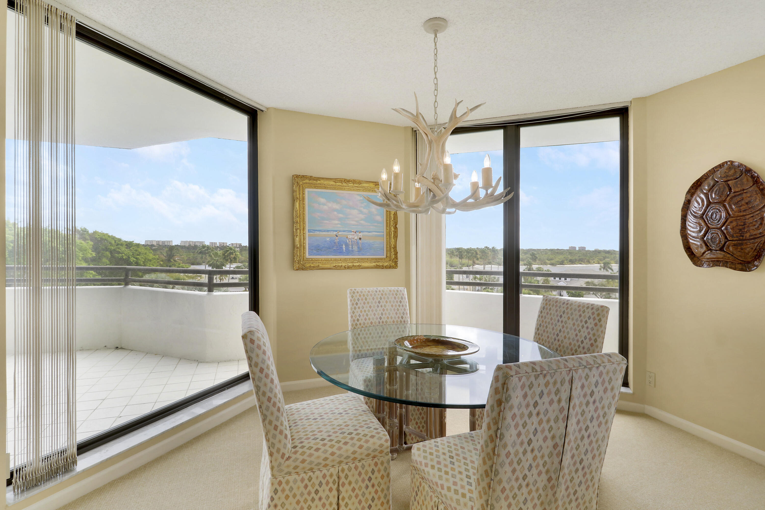 3322 Casseekey Island Road, Unit 604 Jupiter, FL 33477 - Photo 16 of 55 a view of a dining room with furniture window and outside view