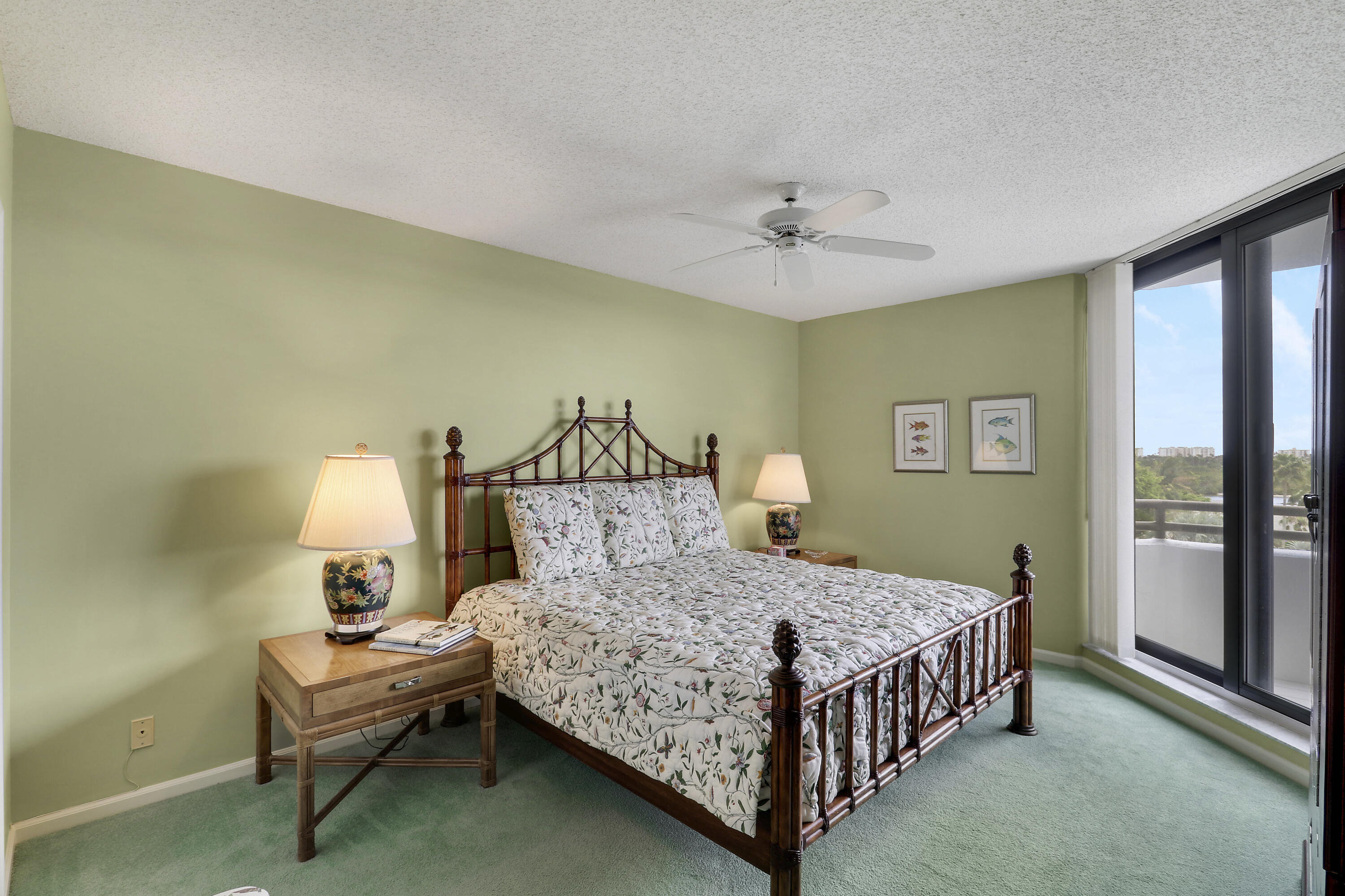 3322 Casseekey Island Road, Unit 604 Jupiter, FL 33477 - Photo 23 of 55 a bedroom with a bed and a table in it