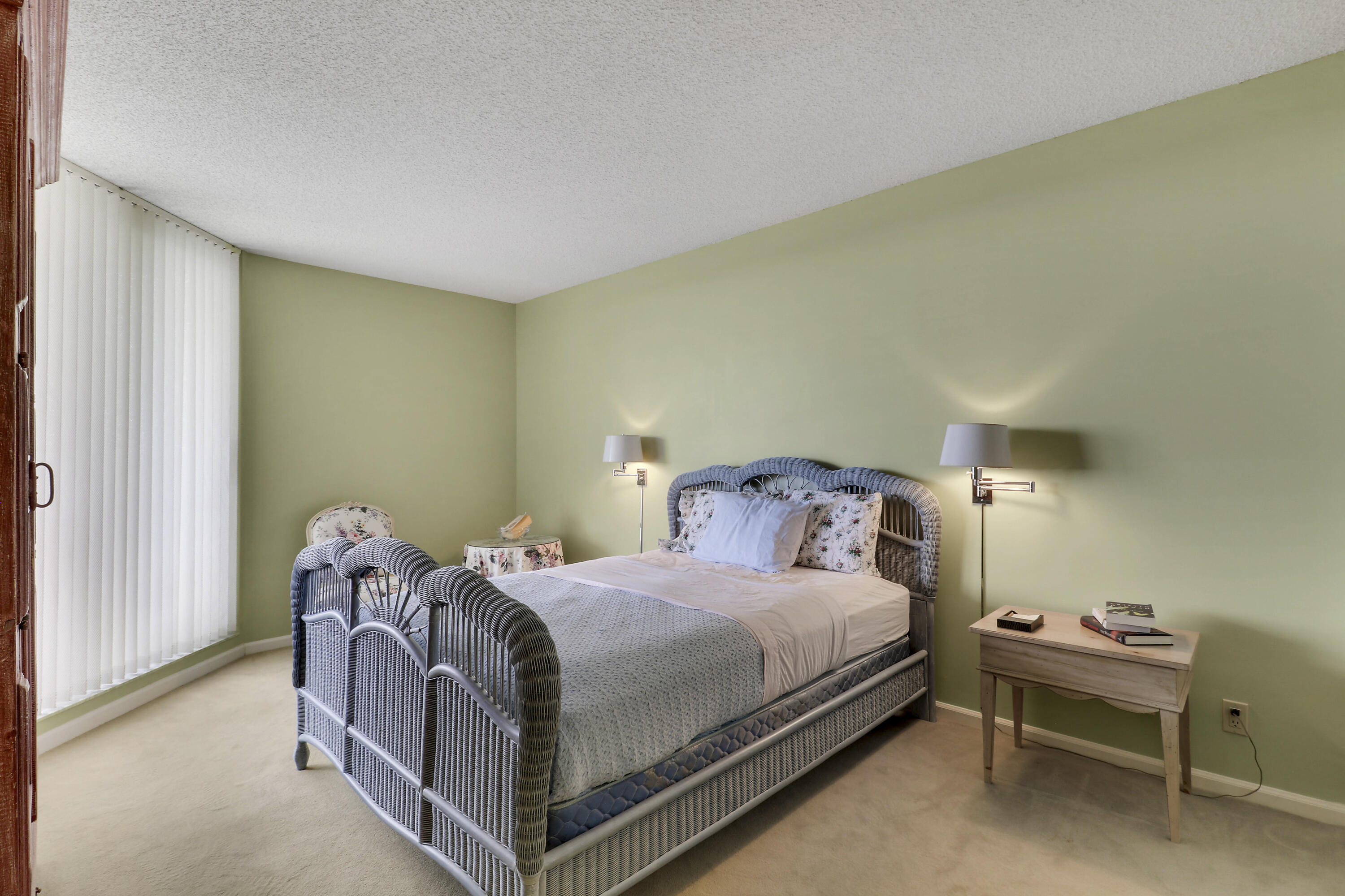 3322 Casseekey Island Road, Unit 604 Jupiter, FL 33477 - Photo 28 of 55 a bed room with a bed and a chair