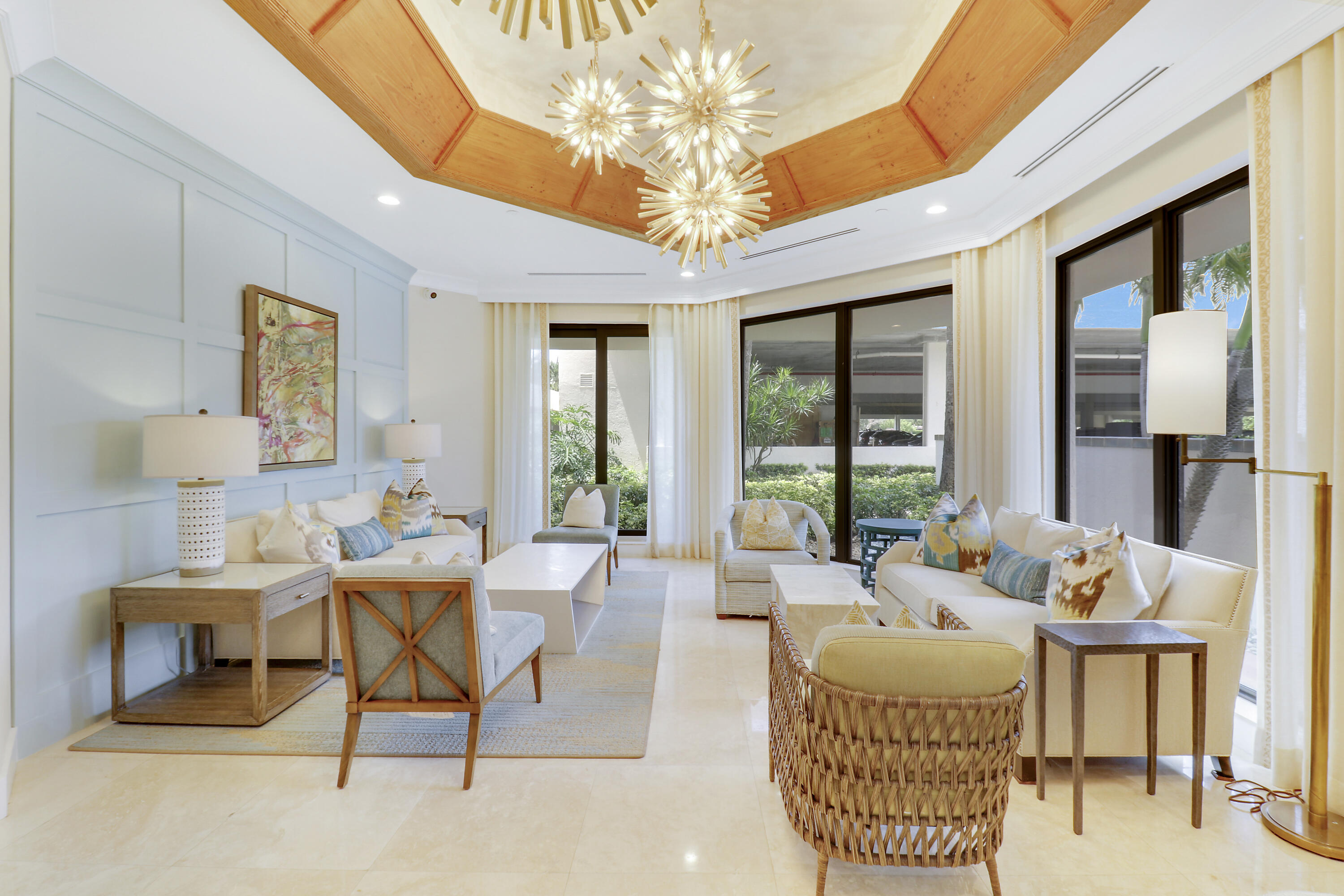 3322 Casseekey Island Road, Unit 604 Jupiter, FL 33477 - Photo 46 of 55 a living room with furniture a chandelier and a dining table