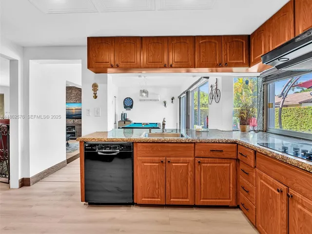 a view of livingroom with furniture flat screen tv and staircase