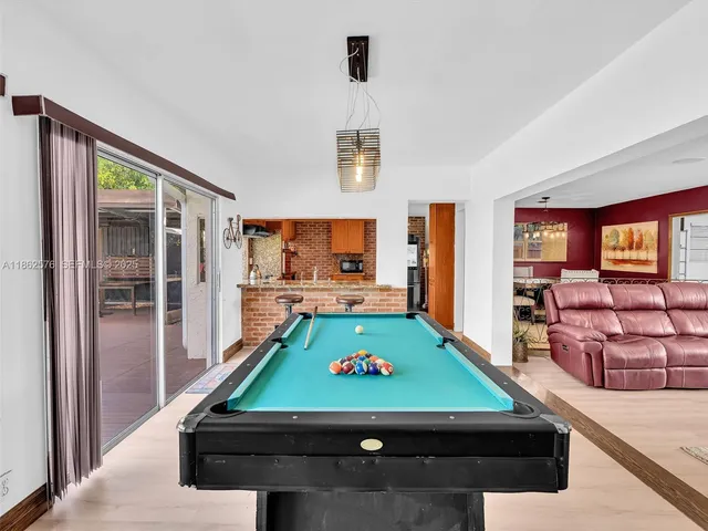 an aerial view of residential houses with city view