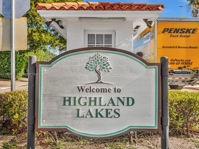 a living room with furniture a rug and a large window
