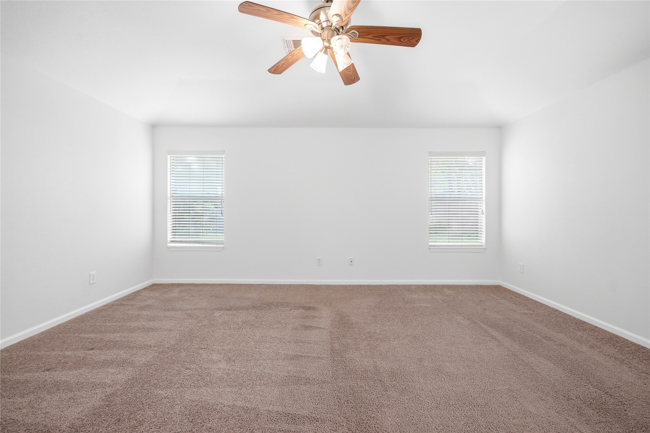5411 Gate Canyon Court Spring, TX 77373 - Photo 18 of 33 an empty room with windows and fan