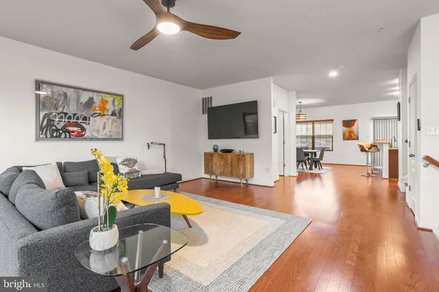 a bathroom with a granite countertop toilet and a sink