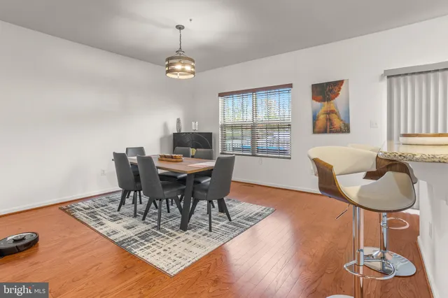 a bathroom with a double vanity sink toilet and a mirror