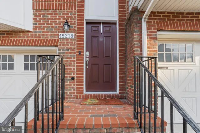a living room with furniture and a table with wooden floor