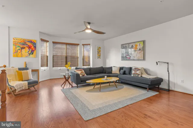 a bedroom with a bed and a chair