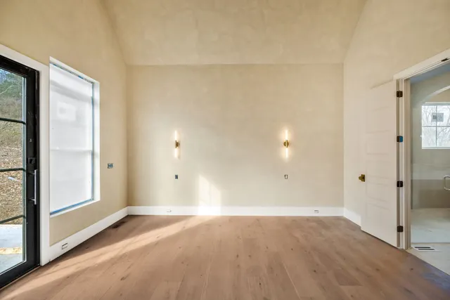 a spacious bathroom with a double vanity sink mirror and shower