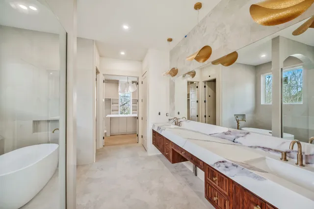 a bathroom with a tub and shower